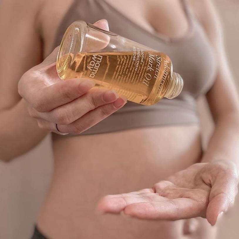Jessica applying Mamaway Advanced Stretch Mark Oil